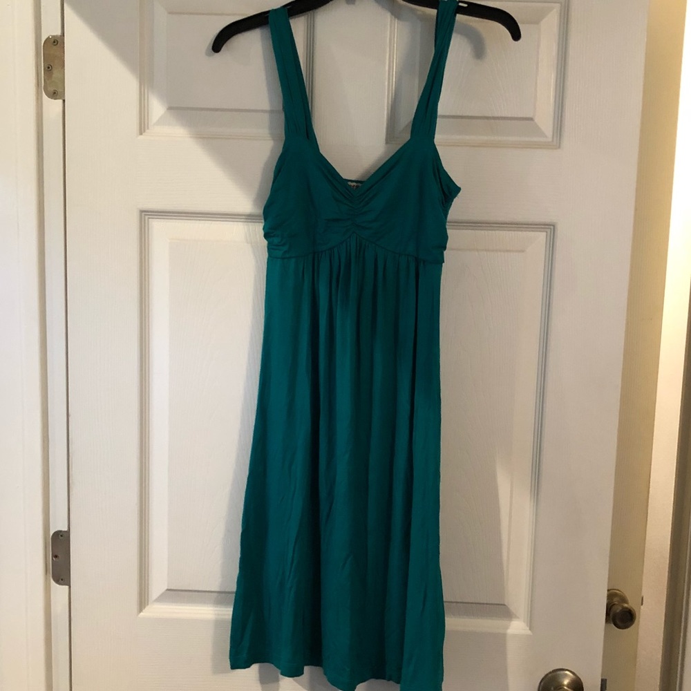 Spaghetti strap green dress.